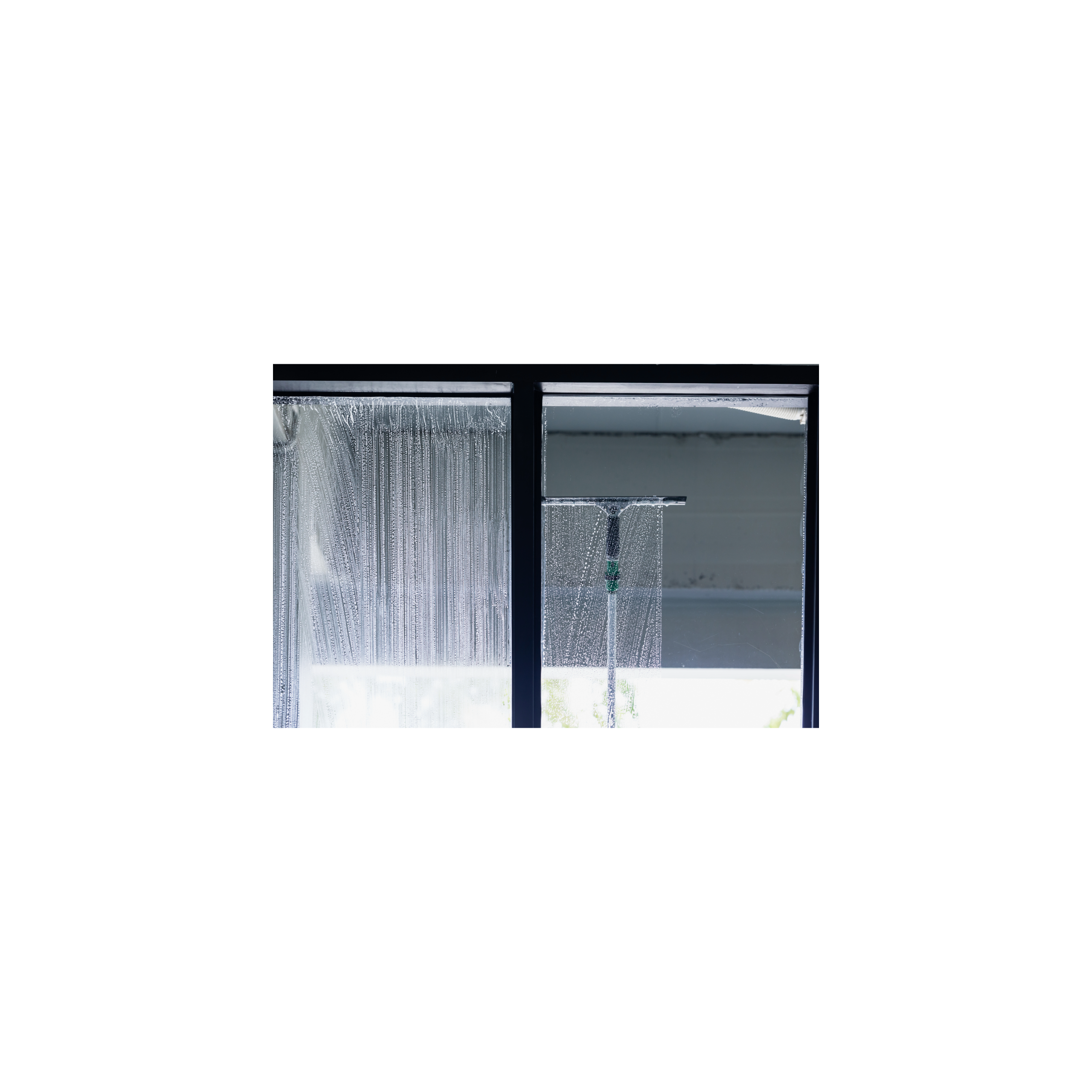 Squeegee cleaning a large pane of glass